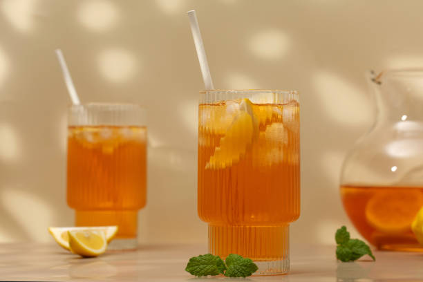 istock Iced tea with lemon and mint in a glass and in a jug. Summer drinks. 1491120057