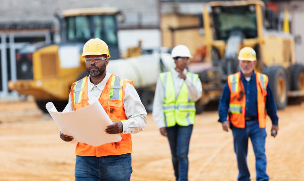 istock African-American man with blueprints at construction site 1491120063