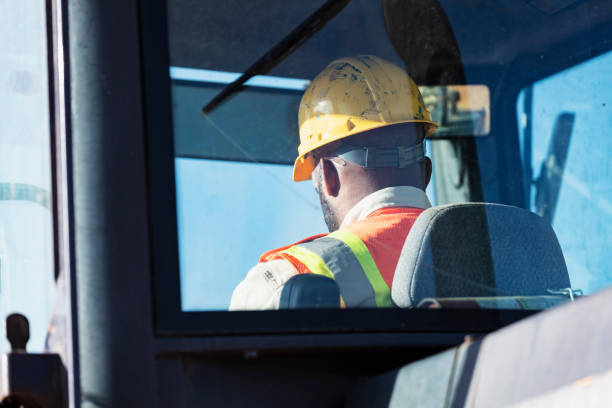 istock African-American man operating a construction vehicle 1491120428