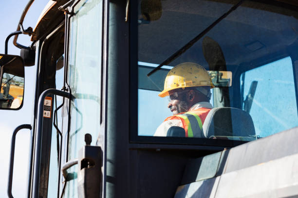 istock African-American man operating a construction vehicle 1491120489