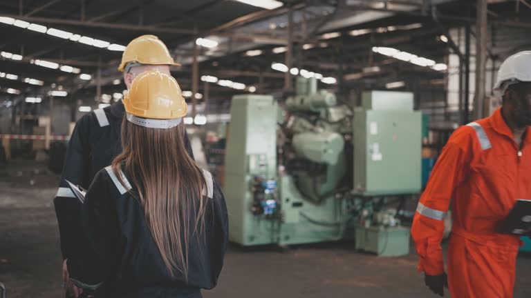 Heavy Industry Engineers consult in Factory.