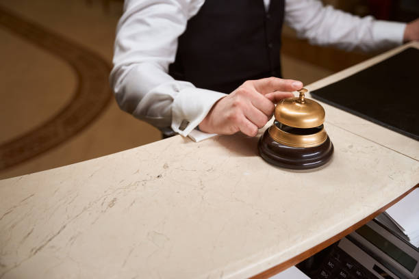istock Male customer touching service bell at reception in the hotel 1491121142