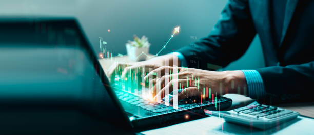 istock Businessman using laptop and analyzing economic growth, financial graph and business investment. planning strategy, stock market statistics, stock market trends, technical analysis strategy, value 1491121355