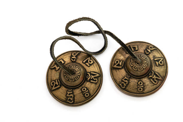 istock Tibetan Buddhist tingsha (tibetan cymbals) with leather strap isolated on white. 1491121982