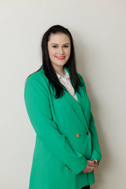 istock Smiling businesswoman against a plain background 1491125781