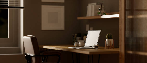 istock Side view of a modern contemporary workspace with laptop mockup on a table 1491129755