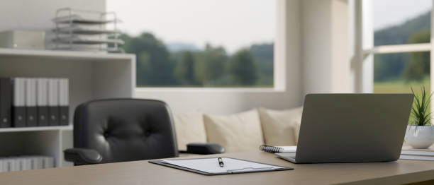istock A modern office with laptop computer, office supplies and decor on a table. 1491130427