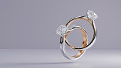 Platinum and gold ring with square diamonds floating on white background from design with 3d render.
