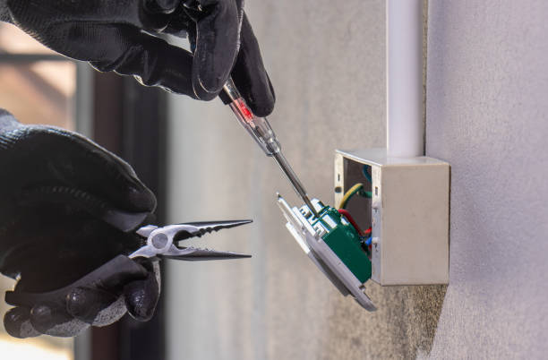 istock Electrician working safely on sockets of a residential electrical system 1491131772