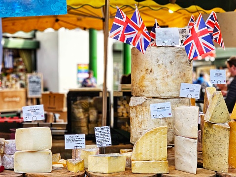 An array of British made cheese on display at Borough Market in London,  UK.