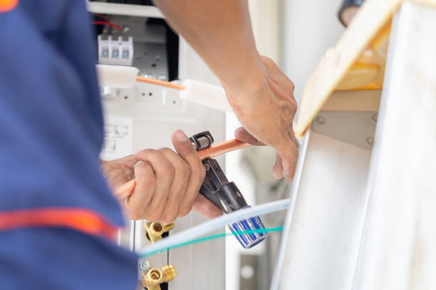 istock Young repairman team fixing air conditioner unit, Asian technician man installing an air conditioning in a client house, Maintenance and repairing concepts 1491140098