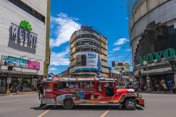 May 5, 2023: A Jeepney drive by Colon Street and Osmena Boulevard intersection. Colon Street is the oldest and the shortest national road in Philippines. It was once the heart of Cebu City.