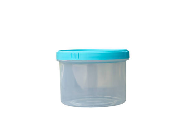 istock Small transparent round plastic container and blue cap isolated on white background with clipping path 1491155845