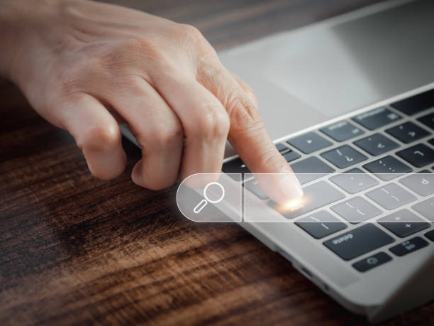 istock Hand of notebook show icon search engine bar. Searching browsing Internet data information data online search concept. 1491157384
