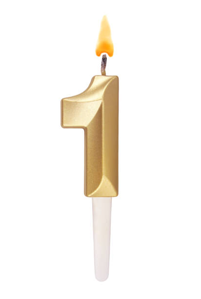 istock Gold birthday candle isolated on white. Number 1. 1491160831