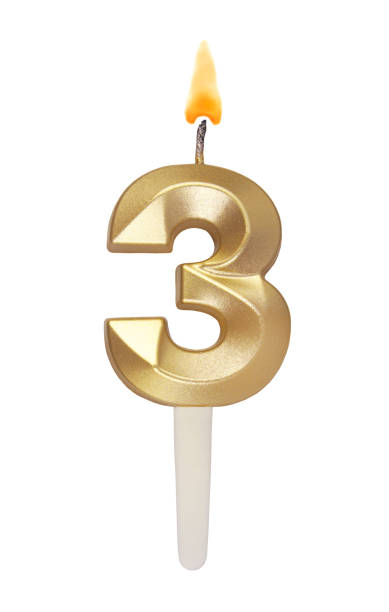 istock Gold birthday candle isolated on white. Number 3. 1491160834