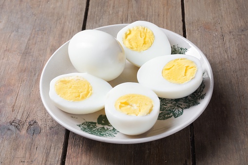 Slice-boiled eggs on the table. Hard-boiled eggs are an excellent source of lean protein