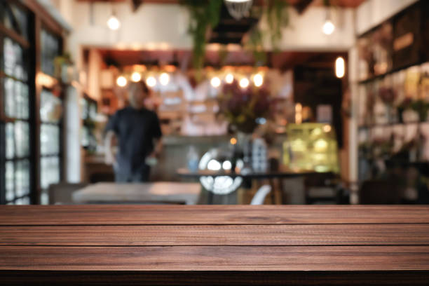 istock Cafe Bistro with Empty wood table for product display montage. 1491162306