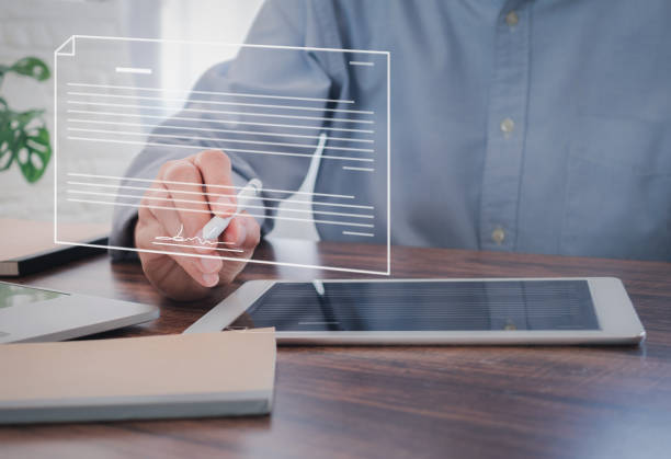 istock Businessman using stylus pen signing on virtual screen over digital tablet in the office 1491163016