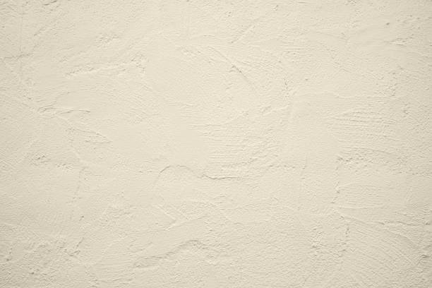 beige wall concrete texture rough. beautiful patterned beige wall texture background pattern. abstract background concept - stenen muur fotos stockfoto's en -beelden