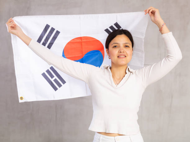 istock Young woman posing in studio with South Korea flag 1491164401
