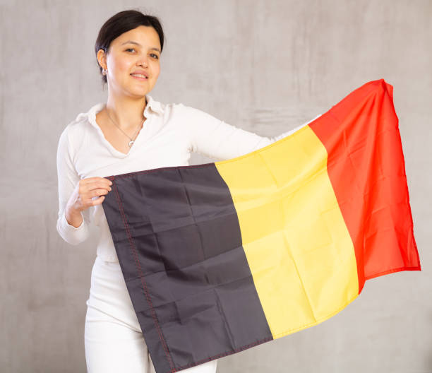 istock Young woman posing in studio with Belgian flag 1491164403