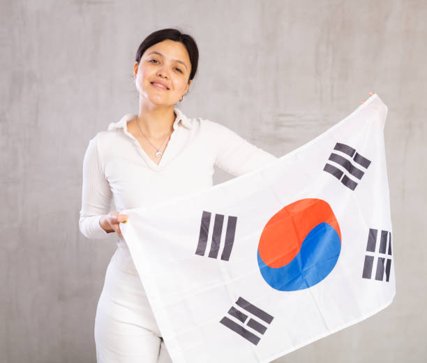 istock Young woman posing in studio with South Korea flag 1491164407