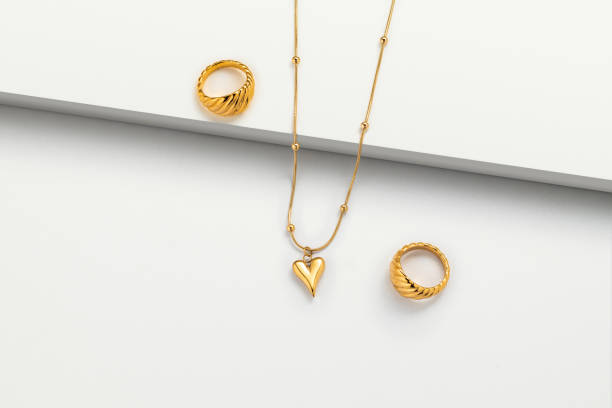 istock Gold necklace jewelry on white background 1491164470