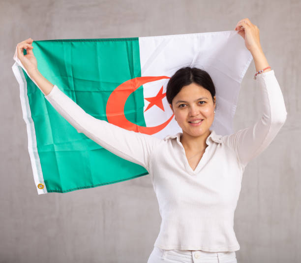 istock Young woman posing in studio with Algeria flag 1491164522