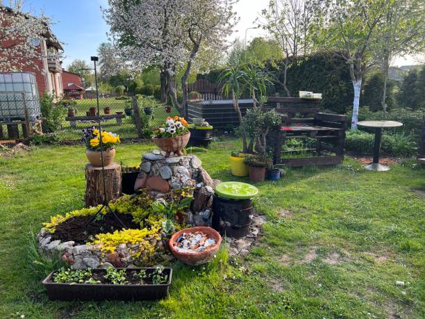 istock garden in spring, the first spring flowers bloom, garden arrangement 1491164548