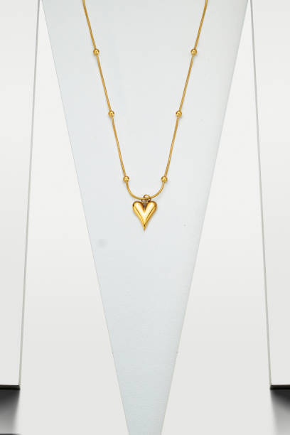 istock Gold necklace jewelry on white background 1491164715