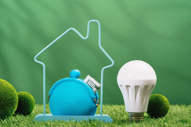 istock Glowing LED light bulb on green background. Green energy 1491164943