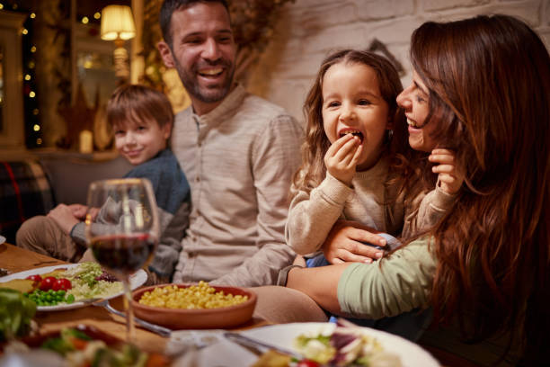 istock Happy family enjoying during lunch in dining room. 1491175133