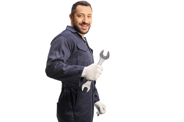 istock Car mechanic holding a wrench and looking over shoulder 1491175845