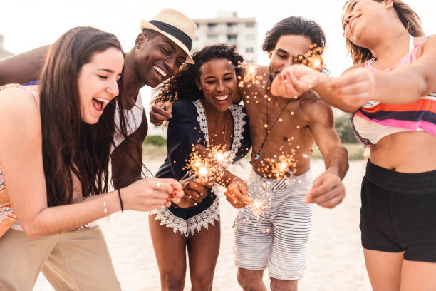 istock friends celebrate at the beach 1491176492