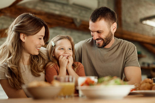 istock Happy parents enjoying with their small daughter at home. 1491176830