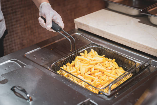 istock Chef holding deep fryer for potatoes in kitchen 1491176839