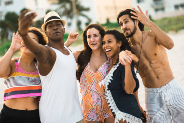 istock people take a selfie on the beach 1491176937