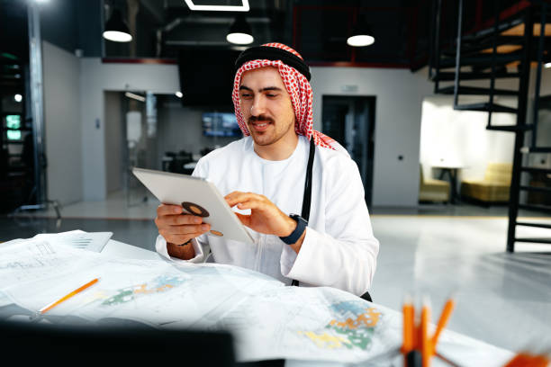 istock Arab muslim businessman using digital tablet in modern office 1491178258