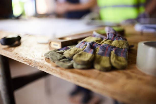 istock Close up of protective gloves at construction site. 1491178799