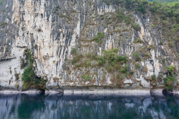 istock Rock formation of karst hills by Li River. 1491180161