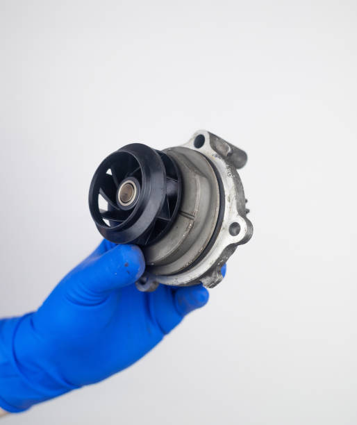 istock Timing belt cracked. Replacing a failed engine transmission belt. Cracks in rubber and risk of broken cords. Replacement of equipment according to the regulations. Mechanic in blue gloves 1491181882