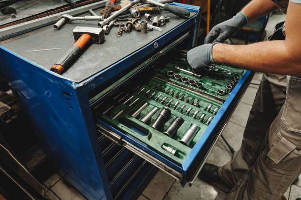 istock Male technician standing near tool table in car service 1491184776