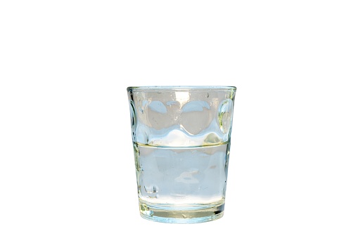 Half glass full with water or half glass empty isolated on white background
