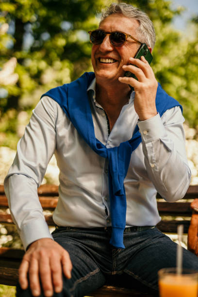 istock A corporate man having a coffee break and making a phone call 1491186947