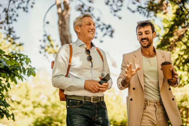 istock Two business persons walking together and talking 1491188468