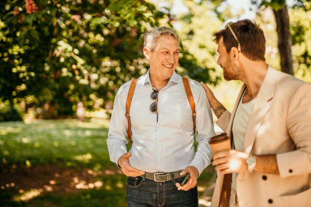 istock Two business persons walking together and talking 1491188503