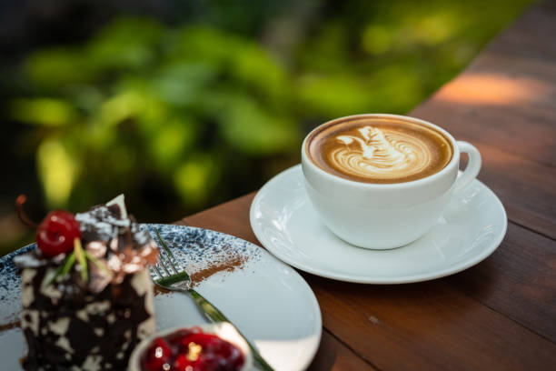 istock Coffee cup with leaf on stone in the garden 1491188880