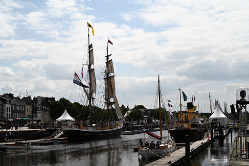 Vannes, France, may 17, 2023 : Morgenster sailboat and Hydrograaf steamer during Gulf Week in the port of Vannes