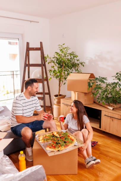 istock Couple taking a break making a toast while moving in together 1491191162